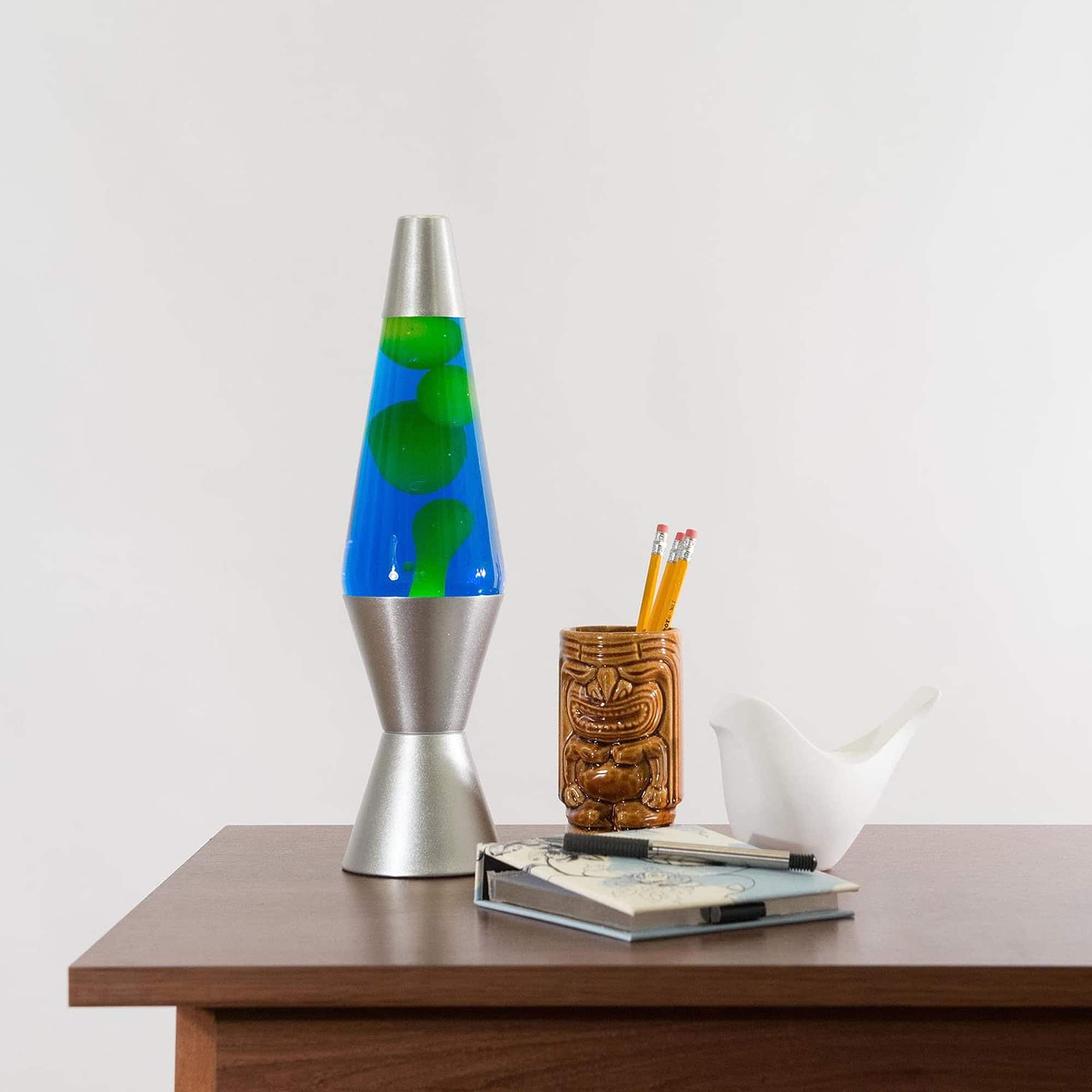 14.5" LAVA� Lamp - Yellow/Blue/Silver on a table with a notebook and tiki mug pencil cup
