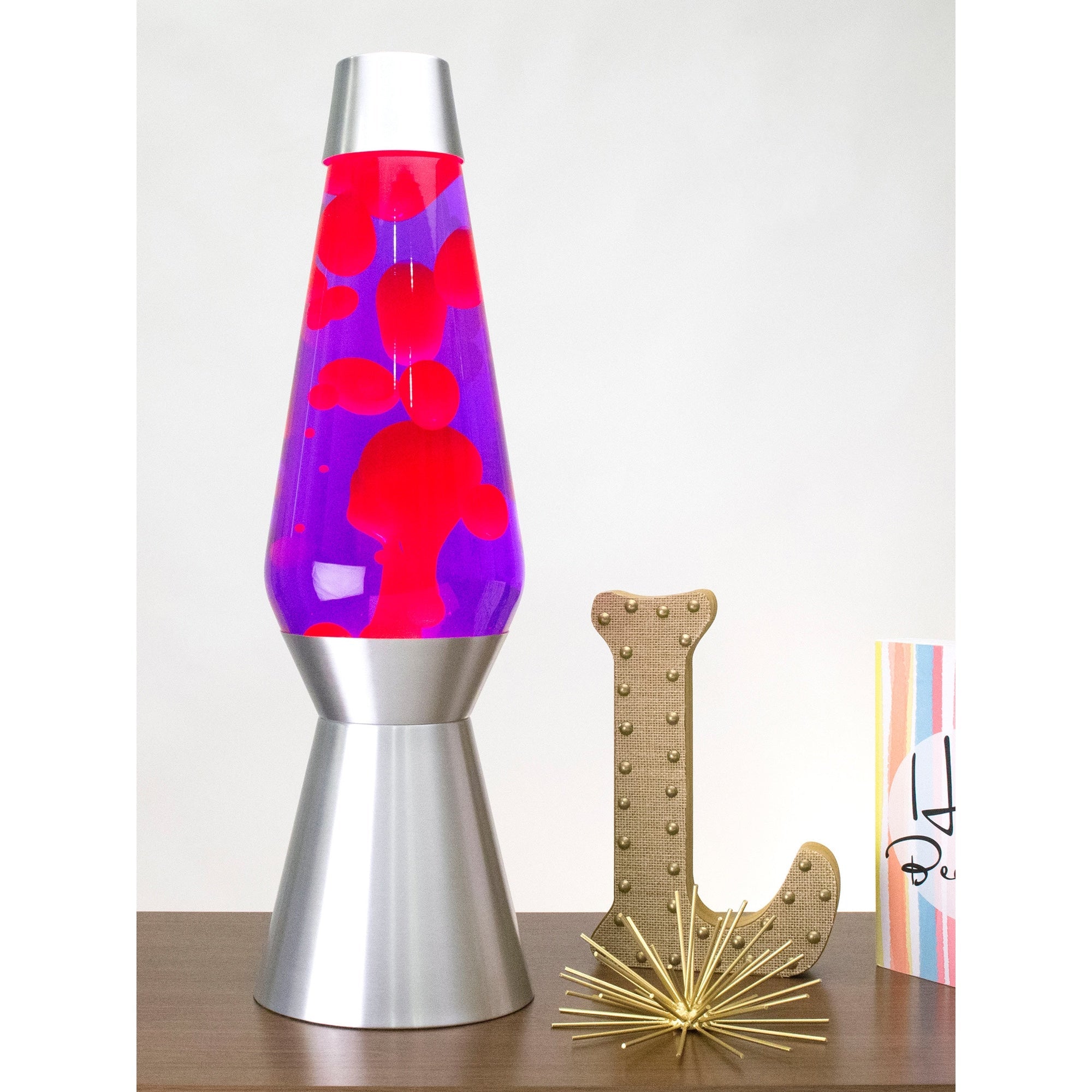 27" LAVA� Lamp Grande - Pink/Purple/Silver on a table with knick knacks